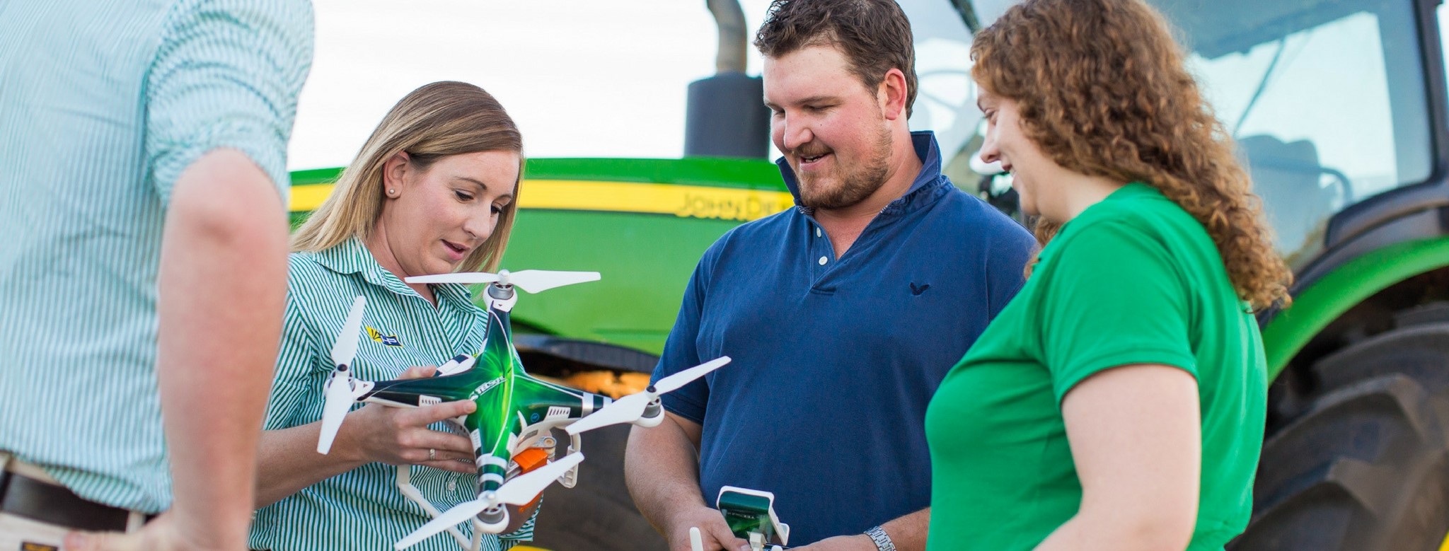 People looking at a drone