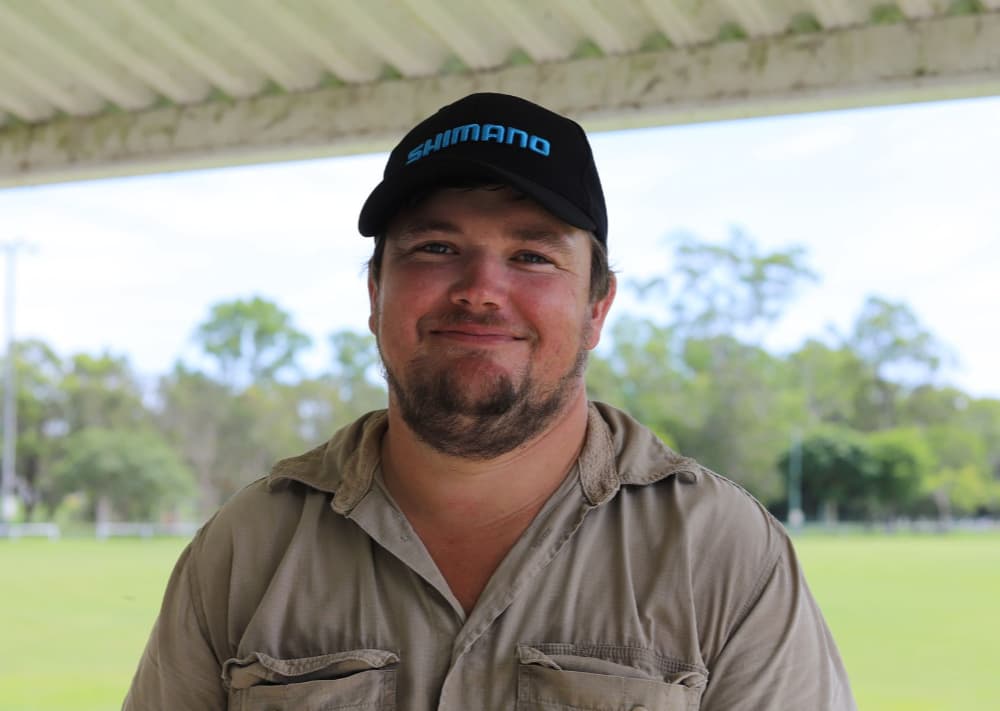 A close-up photo of Phil Brett in a paddock wearing a black cap.